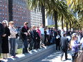 Spectators gathered along the southbound lanes