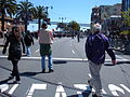 A section of the southbound lanes of The Embarcadero just south of the crosswalk directly in front of the Ferry Building, facing south