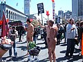 Three nude men protesting China's human rights record near Pier 1