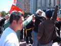 A spectator yells at pro-Chinese spectators