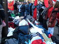 The bags of some pro-China protesters behind the barricaded-off stage and viewing area