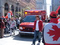 An SFFD ambulance makes its way onto Justin Herman Plaza from Market Street