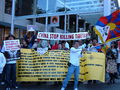 Pro-Tibet protesters behind the closed off viewing area