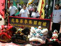 Members of the Buk Sing Choy Lay Fut Kung Fu Association from Fremont, California in Justin Herman Plaza waiting to perform a lion dance to welcome the torch's arrival