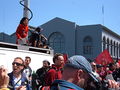 A reporter for KTVU (Channel 2) covers protesters of Chinese support for the Myanmar (Burma) regime near Pier 1