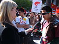 A reporter for the Seven Network in Australia (left) interviews a local Chinese-American pro-Tibet protester near Justin Herman Plaza