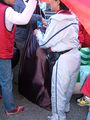 Volunteers load costumes of the five mascots (Fuwa) into storage bags